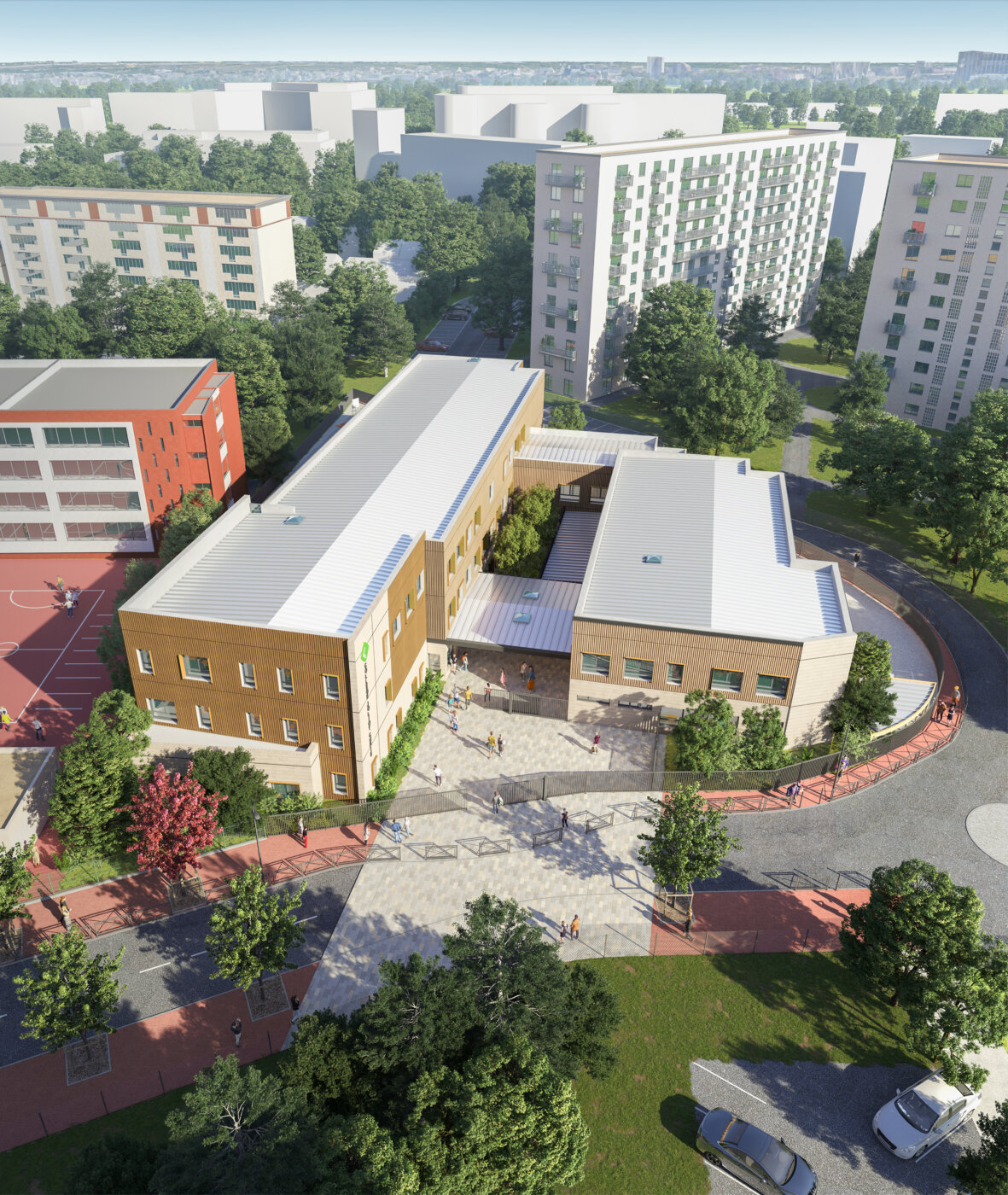 Vue aérienne du collège provisoire Joliot-Curie à Bagneux, deux ailes en L autour d’une cour d’entrée couverte, au milieu des logements collectifs