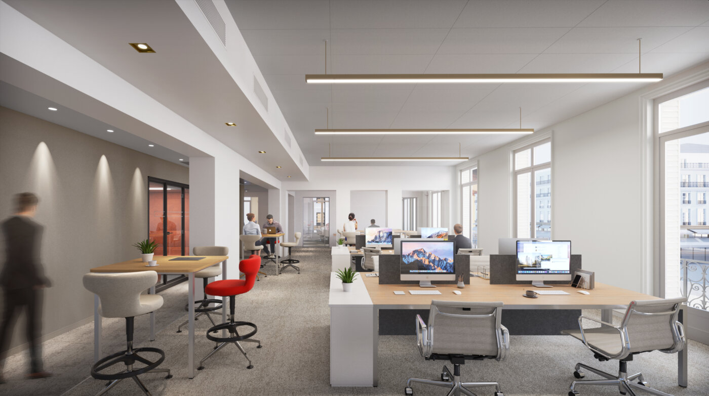 Un plateau de bureaux du 178 rue Montmartre à Paris, postes de travail en open space et fenêtres sur rue